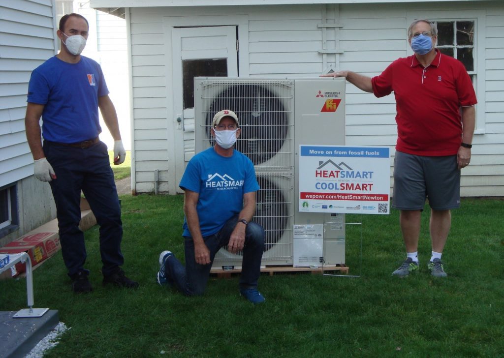 Left to right: Renato Mile (installer from New England Ductless), Craig Forman (coach for HeatSmart Newton), and Tim Tippett (homeowner)